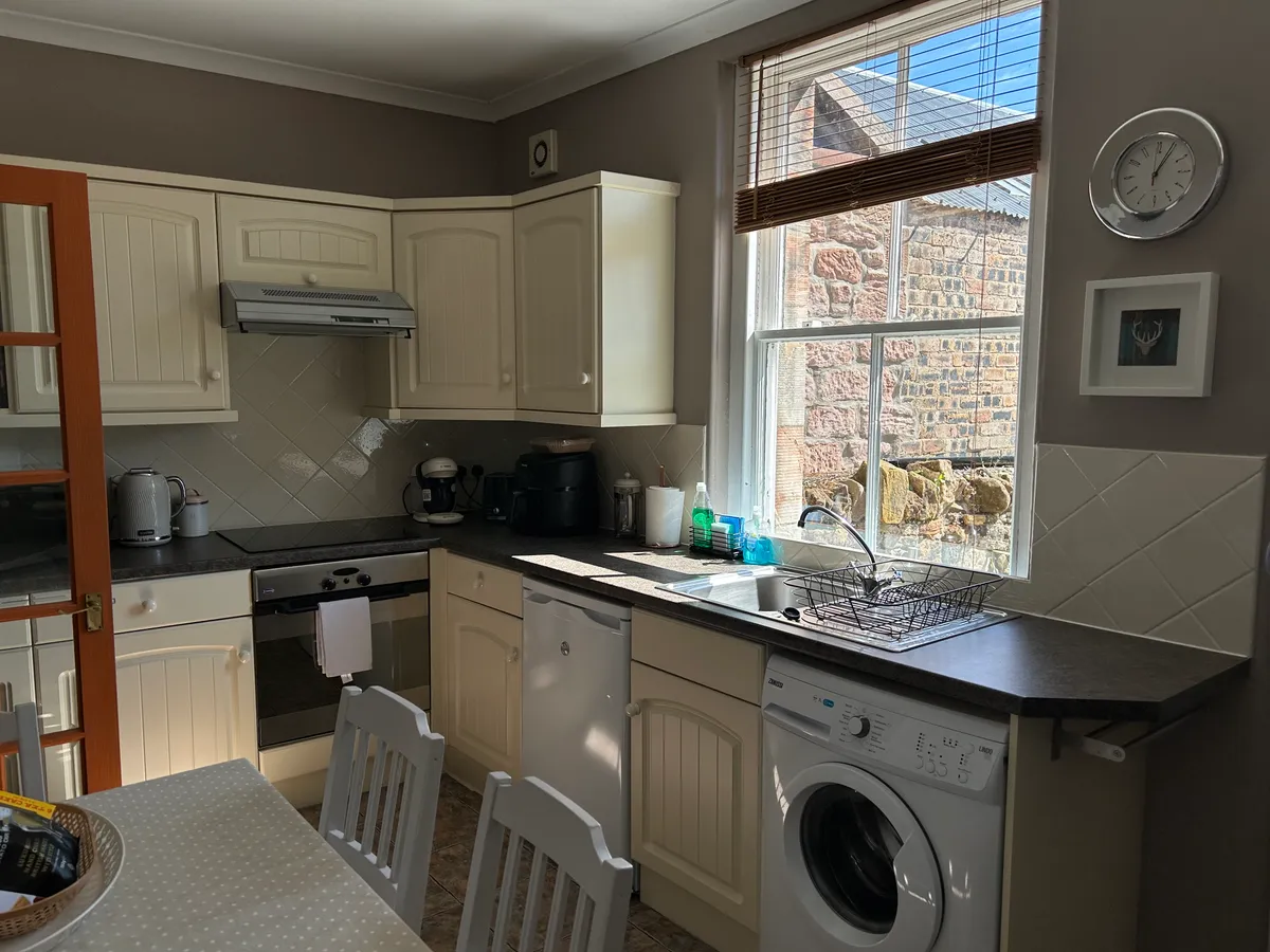 Kitchen with dining table and four chairs