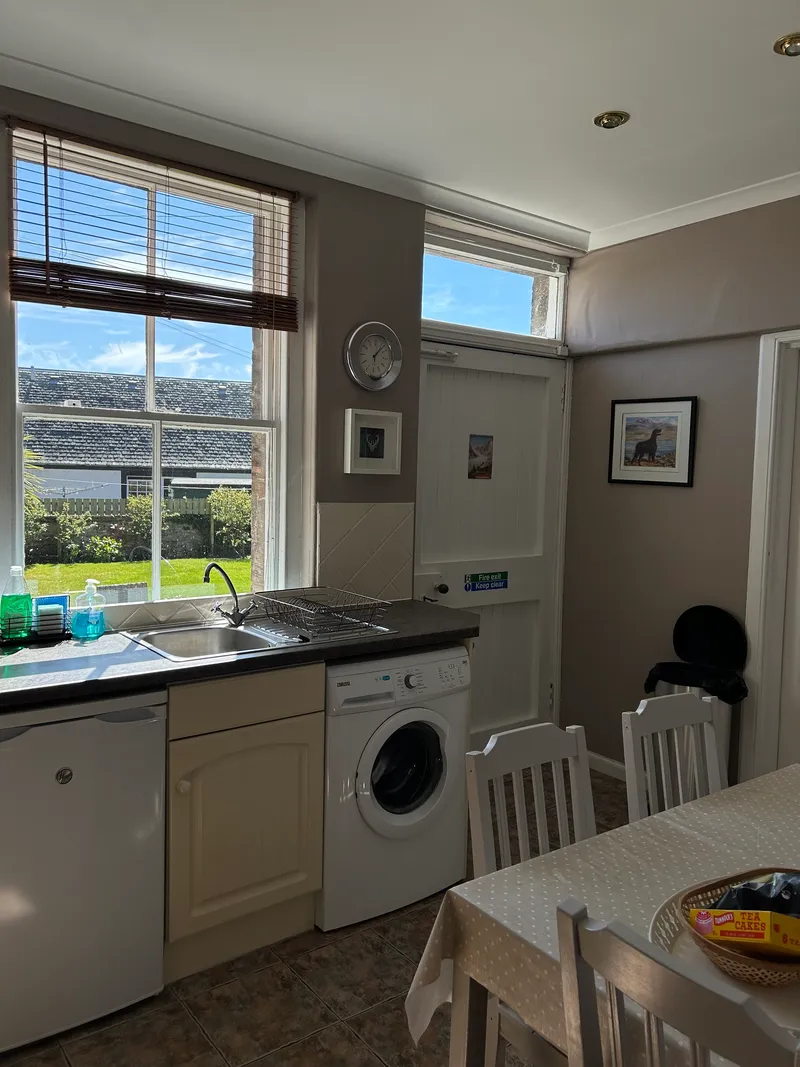 Kitchen with dining table and four chairs