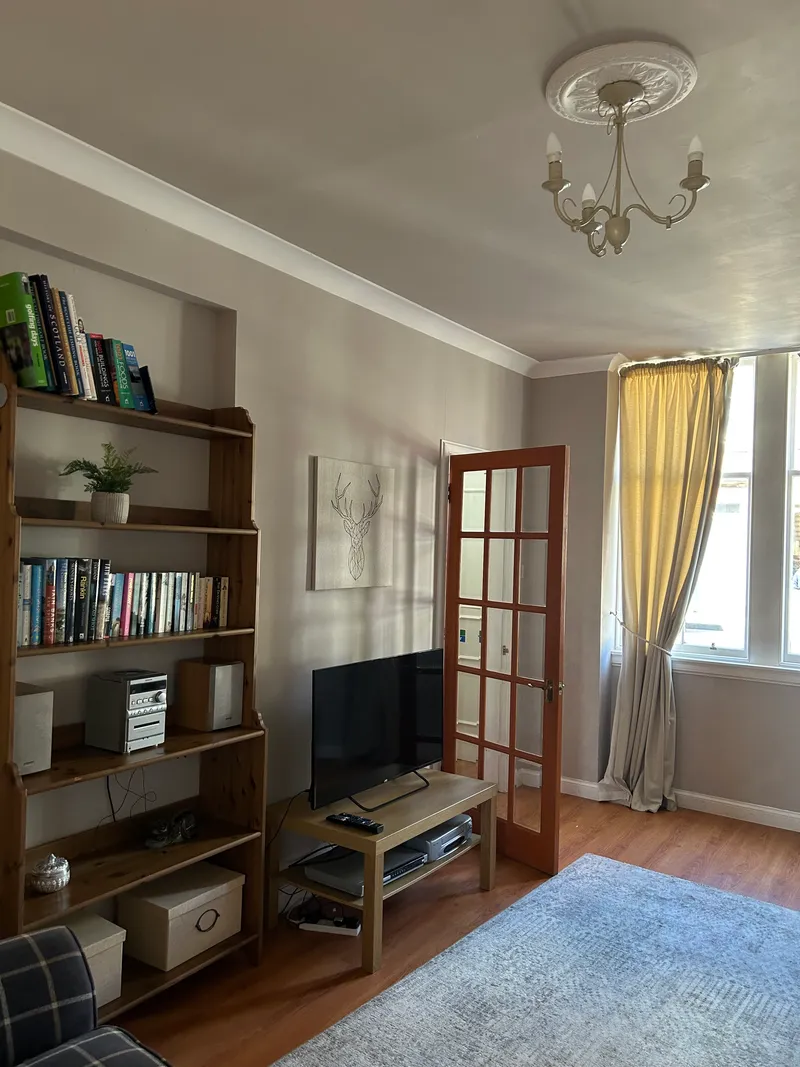 Living room with sofa seating and smart TV